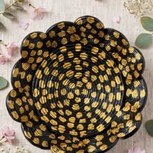 Top view of the black and gold flower-shaped decorative bowl with hand-painted gold dots on spiral coils